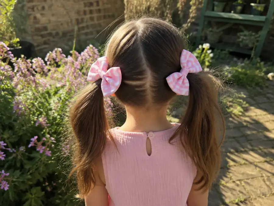 Little girl with matching pigtail bows