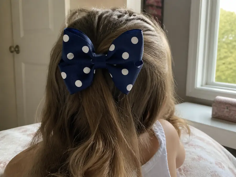 A new polka dot bow in her hair